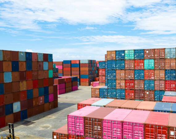 Container logistic. Cargo and shipping business. Container ship for import and export logistic. Container freight station. Logistic industry from port to port. Container at harbor for truck transport.